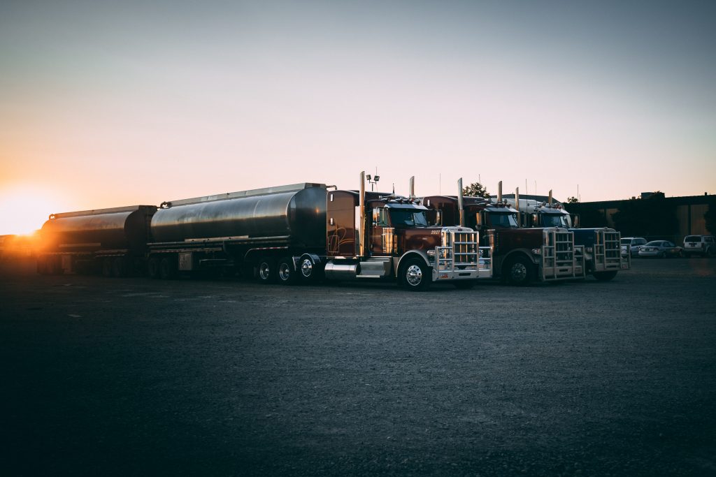 Tanker trucks at sunset.